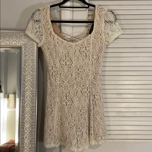Ivory lace romper with nude undertone